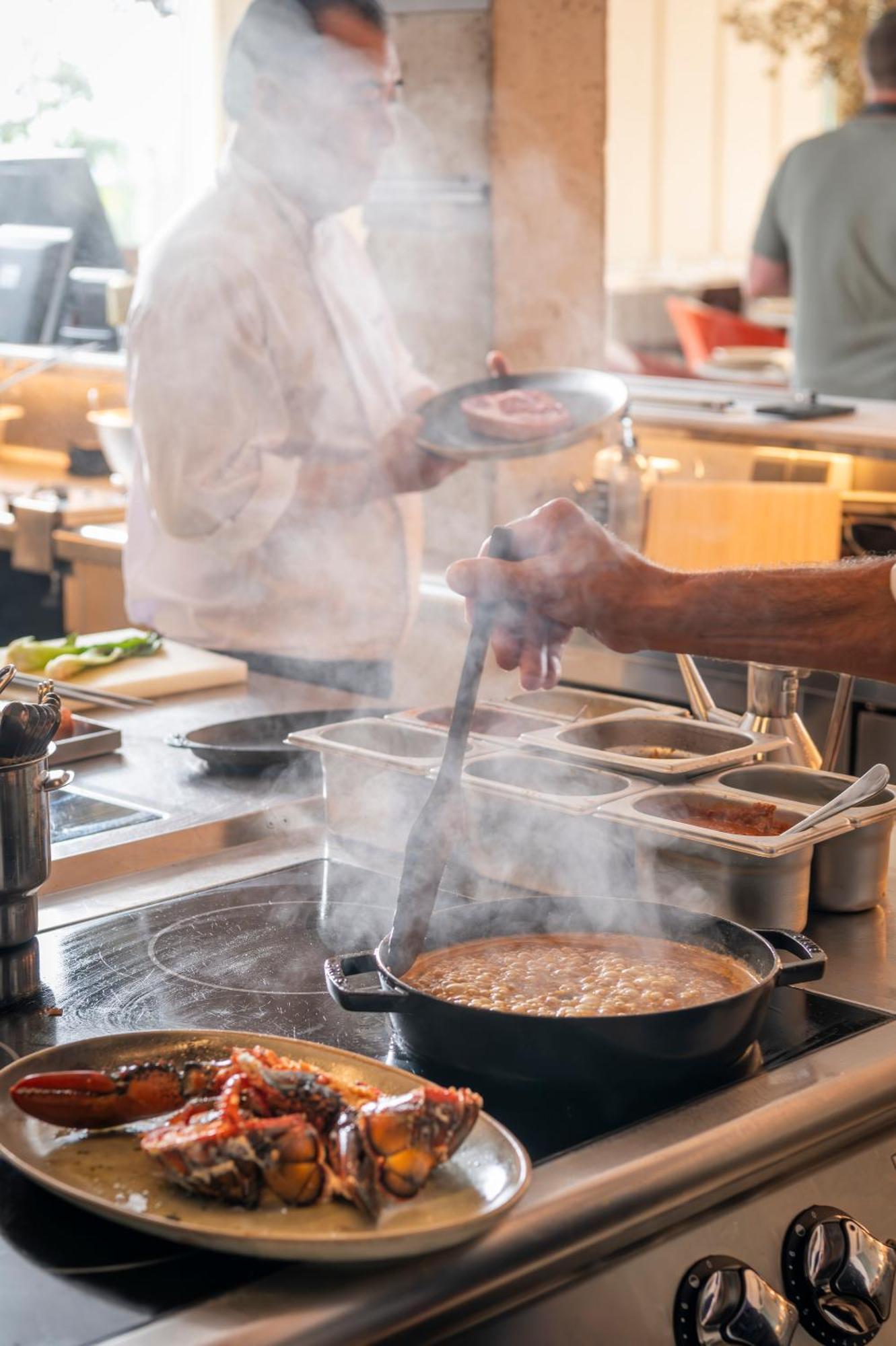 Atzavara Hotel & Spa Santa Susanna Exterior photo A chef stirring a pot of soup